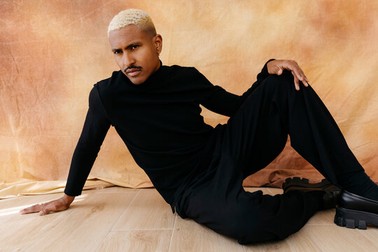 Man with bleached hair posing confidently