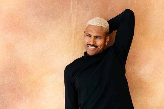 Smiling man with blonde hair and mustache 