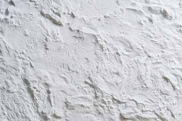 Obraz premium White textured plaster wall featuring rough mineral peaks in a sharp macro shot for architectural and interior design branding