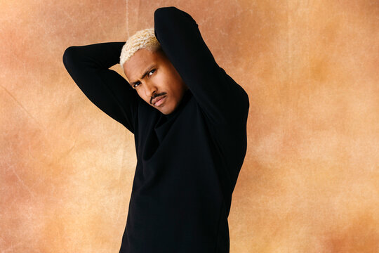 Man posing with confidence in studio