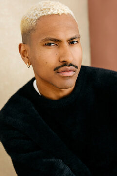 Man with mustache and dyed blonde hair 