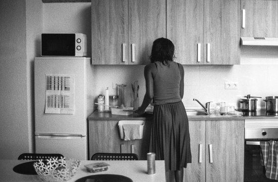 Woman At Kitchen Counter