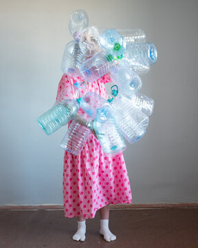 Woman full body portrait with plastic bottles 30