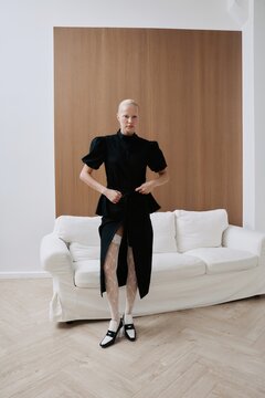 Luxury fashion portrait woman pose before white sofa