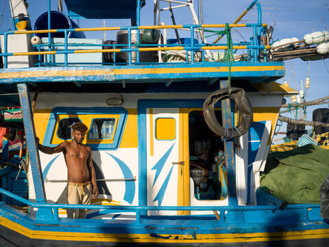 Fisherman on a Colorful Fishing Boat in Sri Lanka