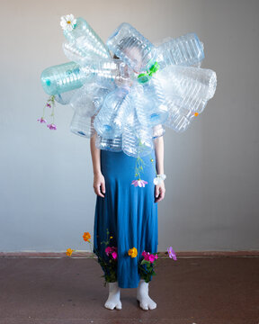 Woman full body portrait with plastic bottles 11