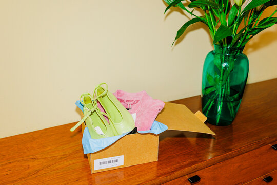 Fashion footwear and apparel arriving in a retail box ugc