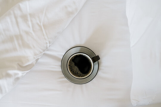 Black Coffee on White Sheets