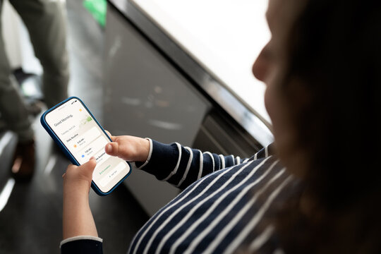 Child interacting with daily routine smartphone app