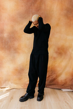 Man holding head