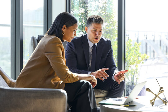 Business Discussion in Hotel Lobby Area