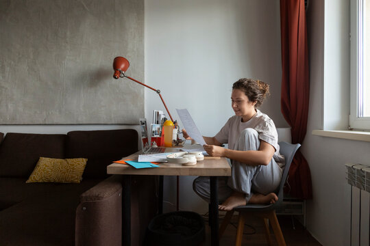 Person working at home reviewing documents