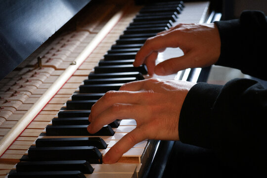 Pianist hands detail during a piano practice