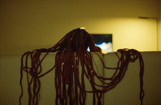 Braids Draped Over Sofa