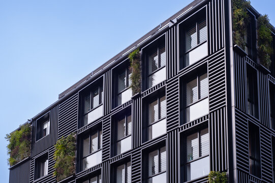 Modern building facade with vertical garden balconies 