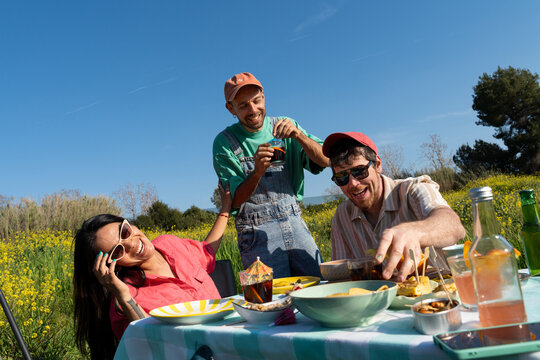 Friends Enjoying Picnic Meal