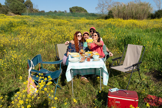Friends Taking Selfie At Picnic