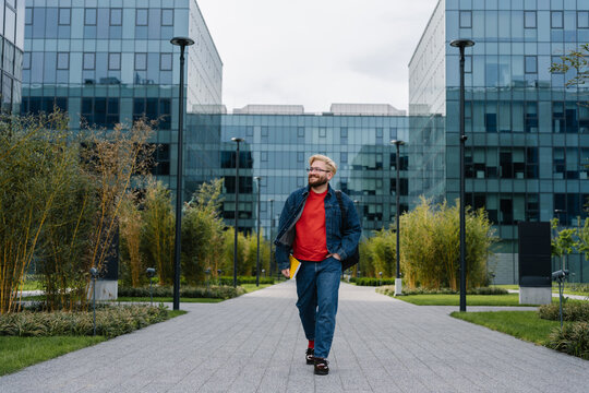 Man walking in office courtyard