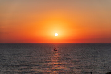 Fototapeta premium Beautiful red and orange sunrise over the sea.