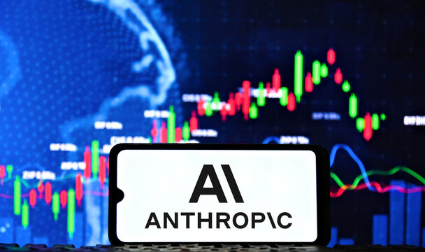 Anthropic AI logo on a smartphone screen with a stock market chart in the background. 