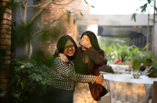 Friends interacting at outdoors looking happy and laughing