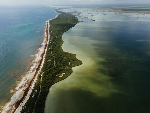 Coastal strip between sea and lagoon in Tulum Mexico
