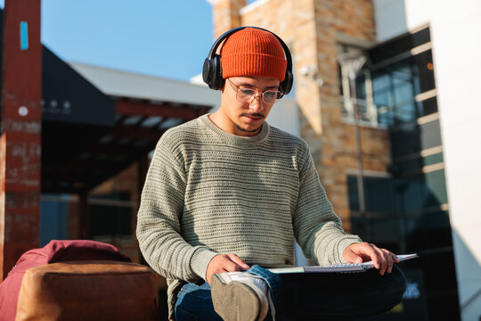 Student man studying with notebook