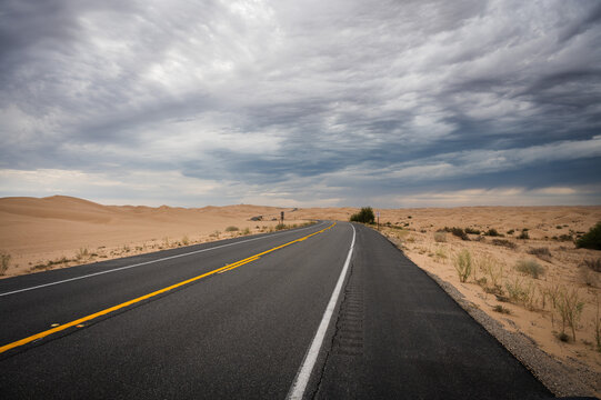 California Highway 78, The Ben Hulse Highway, winds through the Imperial Sand Dunes, or Algodones Dunes, in southeast California.  USA.