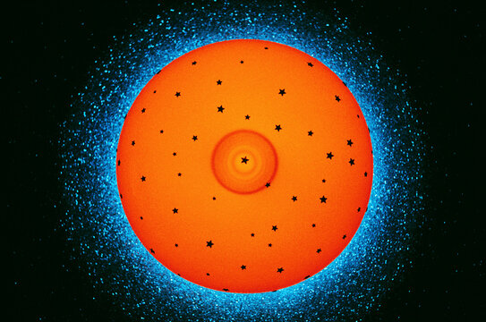 Bright Orange Sphere With Stars 