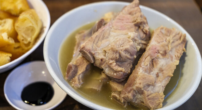 Bak kut teh or Bakut is a pork rib dish cooked in broth, served in Singapore. The Teochew style Bak kut teh which is light in colour but uses more pepper and garlic in the soup