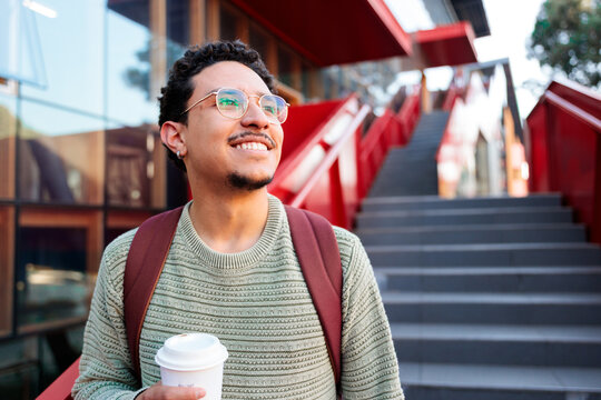 Student man smiling with coffee