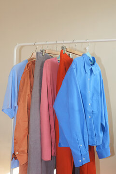 Colourful clothes on the rail