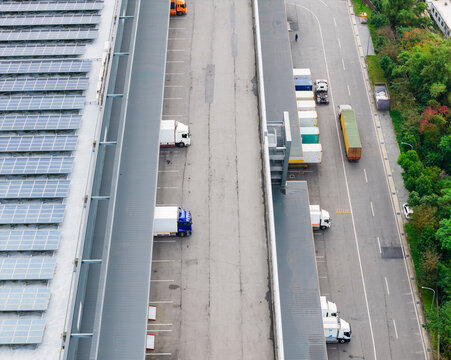 Aerial View of Modern Multilevel Logistics Center Trucks