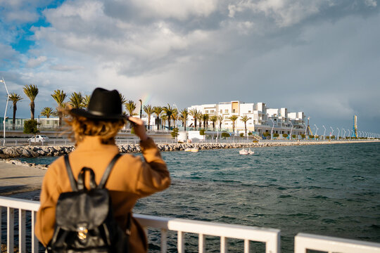 An anonymous woman looking at the sea in Tangier, Morocco.