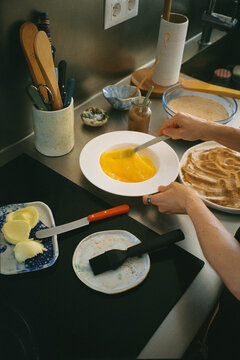 Unidentified woman beating eggs to make traditional Torrijas