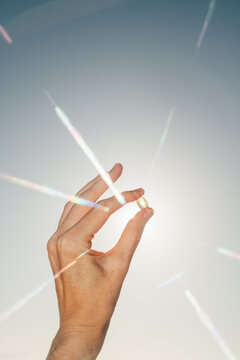 Sunlight Shining Through Vitamin Pill 