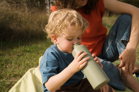 Family enjoys picnic fun in vibrant spring outdoor setting