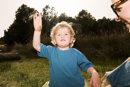 Family enjoys spring picnic in nature with fun activities outdoors