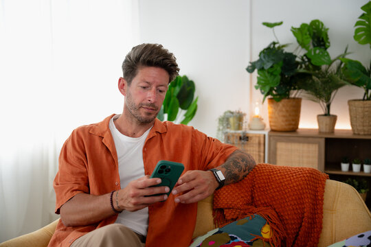 Man relaxing on sofa
