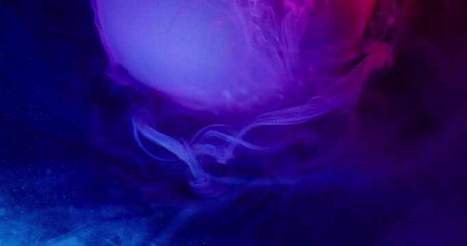 Round ball. Paint wave. Defocused blue purple neon color vapor liquid shimmer particles floating on abstract art dark black background.