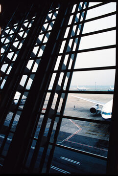 View of an Airport Terminal at Dawn With Planes on the Tarmac