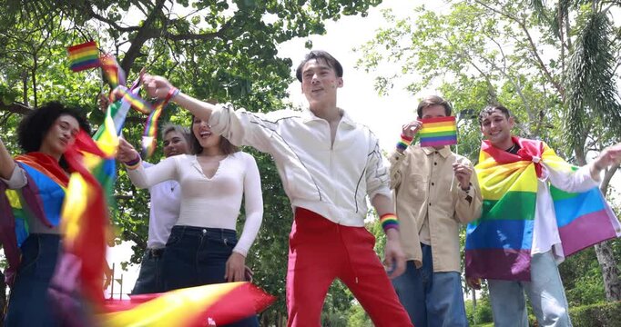 Pride month. Friends from IGBTQ, men, women, lesbians, and transgender people of various nationalities joined the parade, carrying signs and flags celebrating equal rights at Pride Festival.