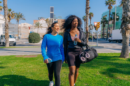 Two women are preparing for sports in the city