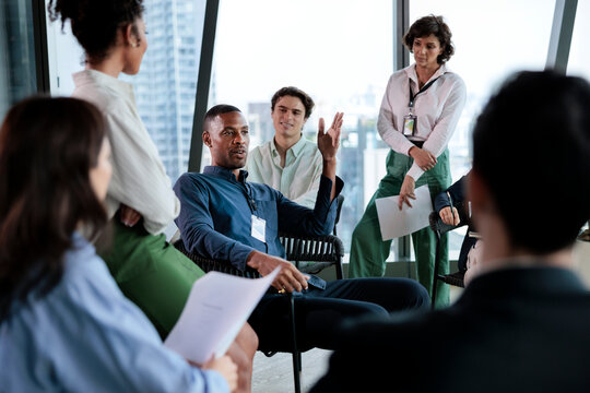 Diverse team collaborates in modern office setting.