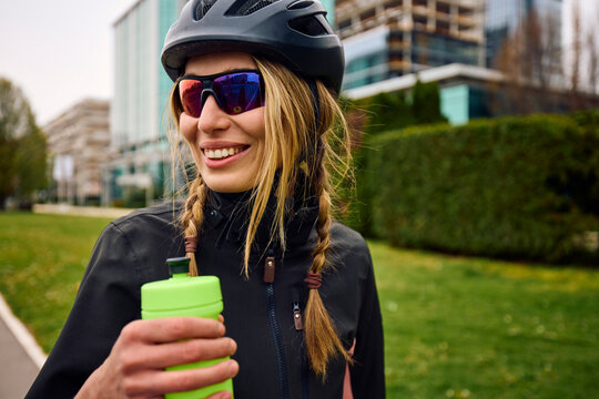 Cyclist Pauses to Hydrate