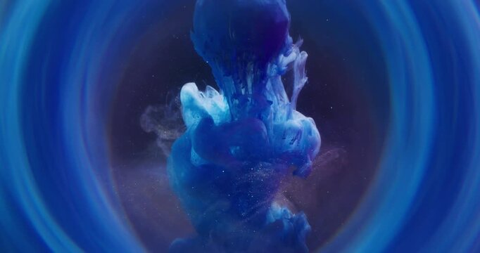 Pigment drop. Sparkling fluid. Blue orange blob spilling paint on diamond sphere. Shiny color curl blend abstract blur circle frame dark background.