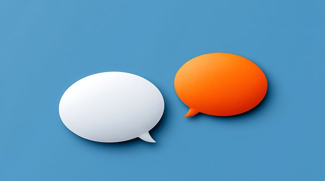 Awesome photo of two oval blank speech bubbles white and orange on light blue background.