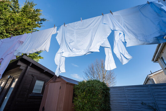 Blue Collar Shirts Hanging in the Early morning. Concept Shot