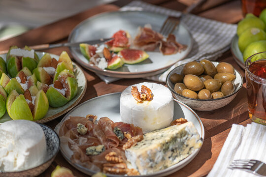 Platter of fresh figs, prosciutto, olives and artisanal cheeses