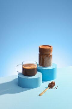 Three refreshing iced coffee drinks displayed on blue